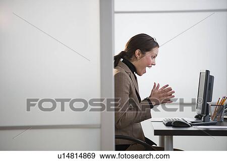 Portrait of young woman in office View Large Photo Image Stock Photo - Portrait of young woman in office. Fotosearch