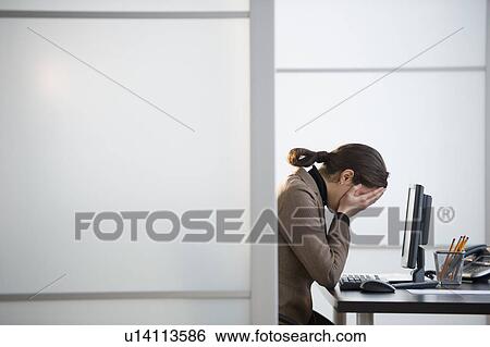 Portrait of young woman in office View Large Photo Image Stock Photograph - Portrait of young woman in office. Fotosearch