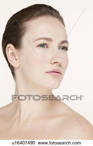 Portrait of young woman looking away View Large Photo Image Stock Image - Portrait of young woman looking away. Fotosearch