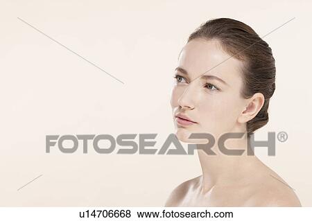 Portrait of young woman looking away View Large Photo Image Stock Photo - Portrait of young woman looking away. Fotosearch