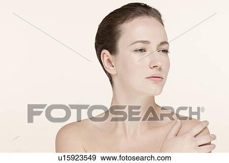 Stock Photo - Portrait of young woman looking away. Fotosearch