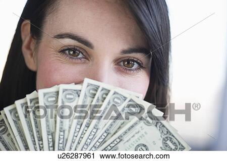 Portrait of young woman with fanned out banknotes View Large Photo Image Stock Image - Portrait of young woman with fanned out banknotes. Fotosearch