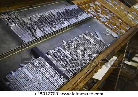 Stock Image - Printing plates on antique printing press. Fotosearch