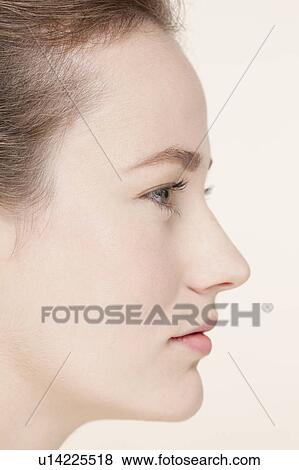 Stock Photo - Profile of young woman . Fotosearch