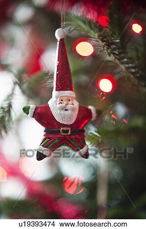Santa Claus Christmas decoration hanging on Christmas tree, studio shot View Large Photo Image Picture - Santa Claus Christmas decoration hanging on Christmas tree, studio shot. Fotosearch
