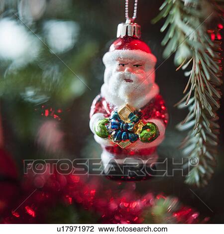 Santa Claus Christmas decoration hanging on Christmas tree, studio shot View Large Photo Image Stock Image - Santa Claus Christmas decoration hanging on Christmas tree, studio shot. Fotosearch
