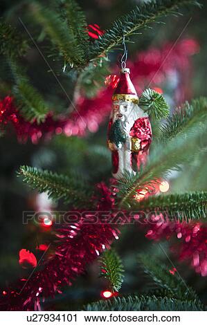 Santa Claus Christmas decoration hanging on Christmas tree, studio shot View Large Photo Image Stock Image - Santa Claus Christmas decoration hanging on Christmas tree, studio shot. Fotosearch