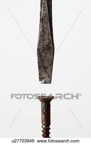 Stock Photo - Screwdriver and screw. Fotosearch