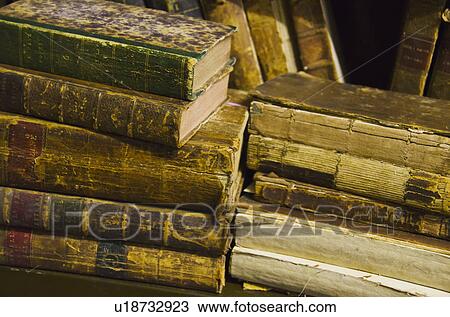Stock Image - Stack of antique books. Fotosearch