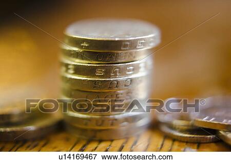 Stock Photo - Stack of coins on table, close-up. Fotosearch