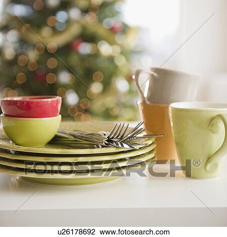 Stock Image - Stacked plates and crockery. Fotosearch