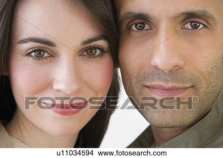 Picture - Studio portrait of couple smiling. Fotosearch