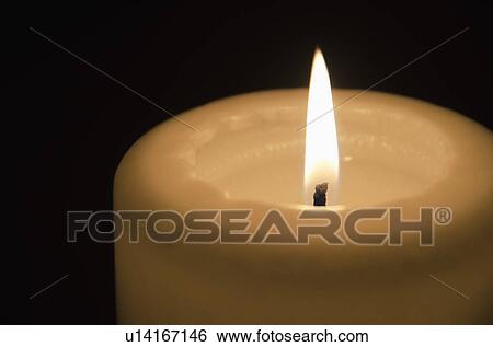 Stock Photograph - Studio shot of candle. Fotosearch