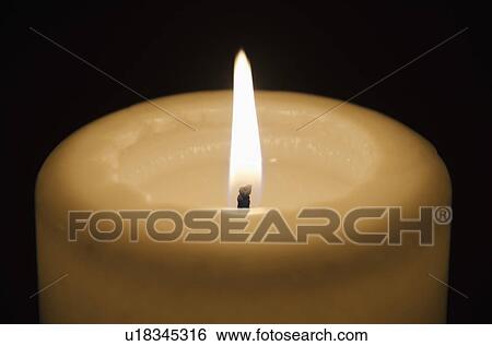 Stock Photograph - Studio shot of candle. Fotosearch