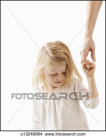 Studio shot of girl (2-3) holding adult's hand View Large Photo Image Picture - Studio shot of girl (2-3) holding adult's hand. Fotosearch