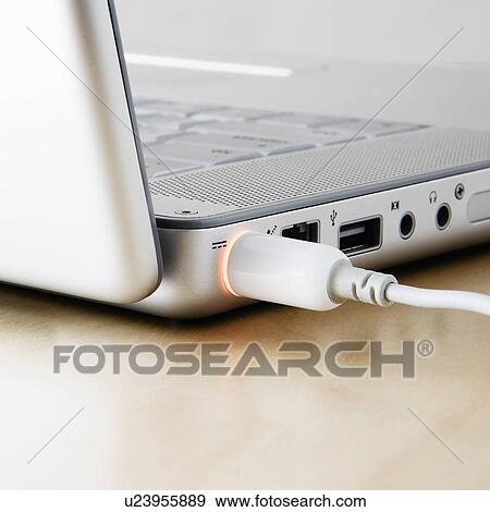 Studio shot of laptop with cable View Large Photo Image Stock Photo - Studio shot of laptop with cable. Fotosearch