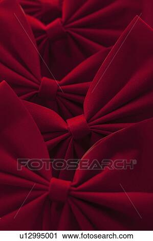 Studio Shot of red velvet bows View Large Photo Image Stock Image - Studio Shot of red velvet bows. Fotosearch