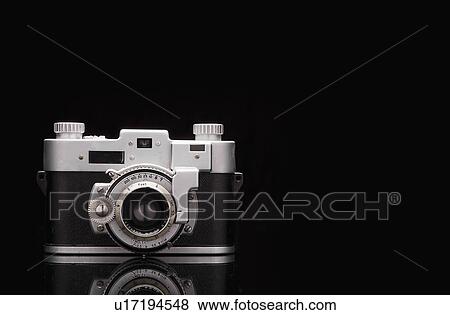 Stock Photo - Studio shot of vintage camera. Fotosearch