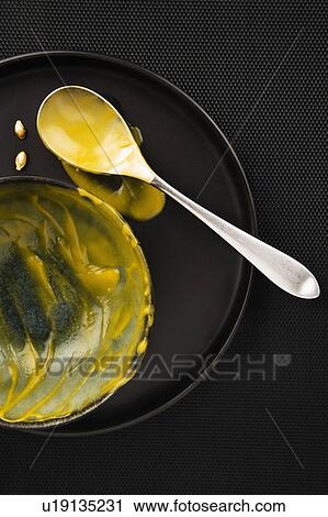 Stock Image - Studio shot of yellow dessert. Fotosearch