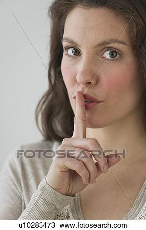 Studio shot of young woman View Large Photo Image Stock Image - Studio shot of young woman. Fotosearch