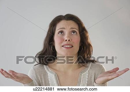 Stock Image - Studio shot of young woman. Fotosearch