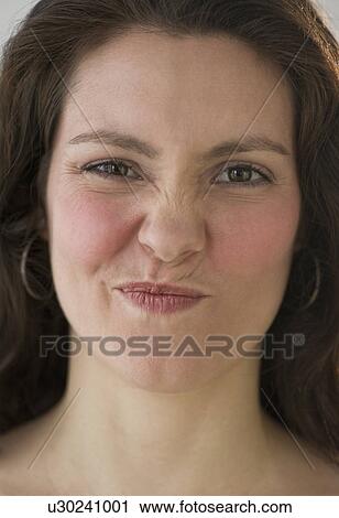 Stock Image - Studio shot of young woman. Fotosearch