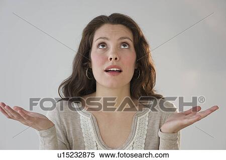 Studio shot of young woman View Large Photo Image Stock Photography - Studio shot of young woman. Fotosearch