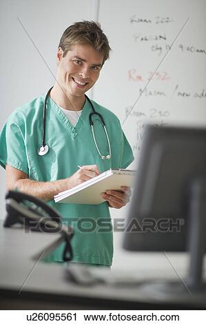 Surgeon working in office View Large Photo Image Stock Image - Surgeon working in office. Fotosearch