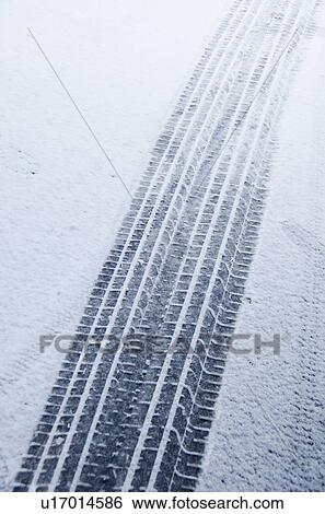 Stock Photograph - Tire tracks in snow. Fotosearch