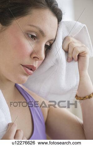 Stock Photograph - Tired young woman at fitness. Fotosearch