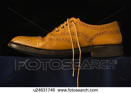 Traditional brogue on black background View Large Photo Image Stock Photograph - Traditional brogue on black background. Fotosearch