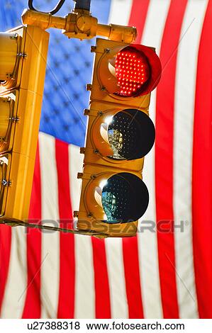 Traffic lights with american flag in background View Large Photo Image Stock Photo - Traffic lights with american flag in background. Fotosearch