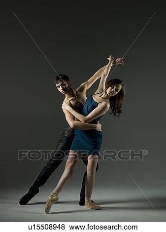 Stock Photo - Two young ballet dancers, studio shot. Fotosearch