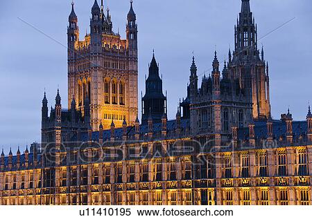 Stock Photography - United Kingdom, London, Houses of Parliament illuminated at dusk. Fotosearch