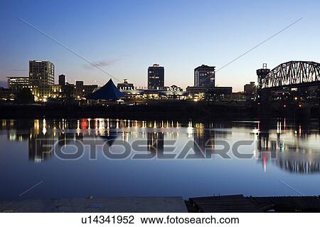 Stock Image - USA, Arkansas, Little Rock, Downtown skyline illuminated at night. Fotosearch