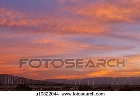 Picture - USA, California, Palm Springs, wind turbines at sunrise. Fotosearch