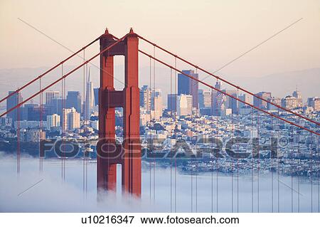 Stock Photo - USA, California, San Francisco, Golden Gate Bridge in fog. Fotosearch