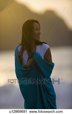 USA, California, San Francisco, Young woman wrapped in blanket at coast View Large Photo Image Stock Image - USA, California, San Francisco, Young woman wrapped in blanket at coast. Fotosearch