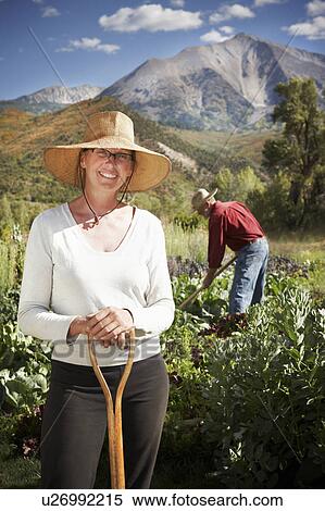 USA, Colorado, Aspen, portrait of female farmer working in field View Large Photo Image Stock Photography - USA, Colorado, Aspen, portrait of female farmer working in field. Fotosearch