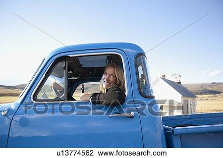 USA, Colorado, Carbondale, Cowgirl driving old fashioned pickup truck View Large Photo Image Stock Image - USA, Colorado, Carbondale, Cowgirl driving old fashioned pickup truck. Fotosearch