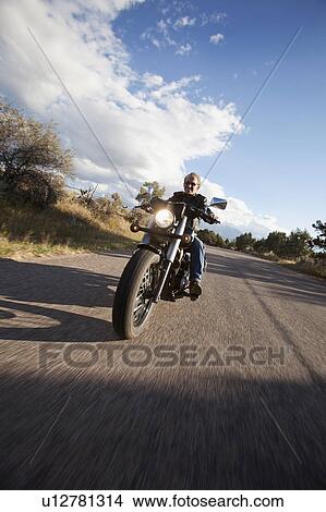 USA, Colorado, Carbondale, Mature man driving motorcycle View Large Photo Image Picture - USA, Colorado, Carbondale, Mature man driving motorcycle. Fotosearch