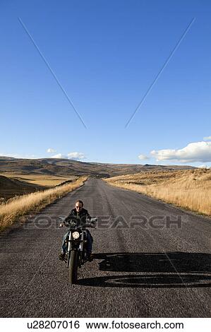 USA, Colorado, Carbondale, Mature man driving motorcycle View Large Photo Image Stock Photograph - USA, Colorado, Carbondale, Mature man driving motorcycle. Fotosearch