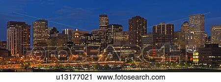 Stock Image - USA, Colorado, Denver, panoramic cityscape at night. Fotosearch