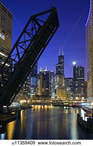 Stock Photo - USA, Illinois, Chicago, City reflected in Chicago River. Fotosearch