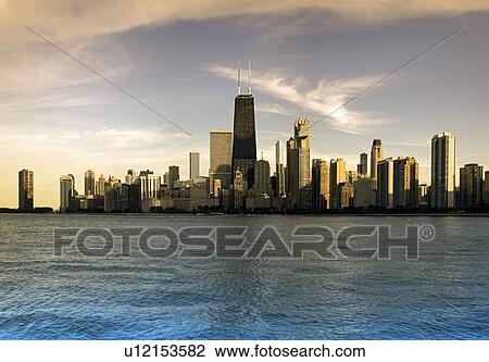 USA, Illinois, Chicago, City skyline over Lake Michigan at sunset View Large Photo Image Stock Image - USA, Illinois, Chicago, City skyline over Lake Michigan at sunset. Fotosearch