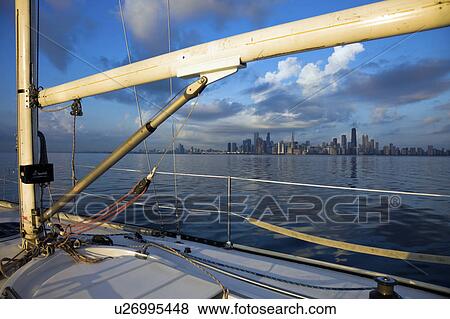 Stock Photo - USA, Illinois, Chicago, City skyline from yacht on Lake Michigan. Fotosearch