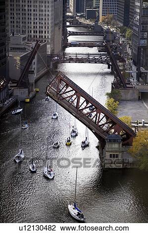 Stock Image - USA, Illinois, Chicago, elevated view of canal with yachts. Fotosearch
