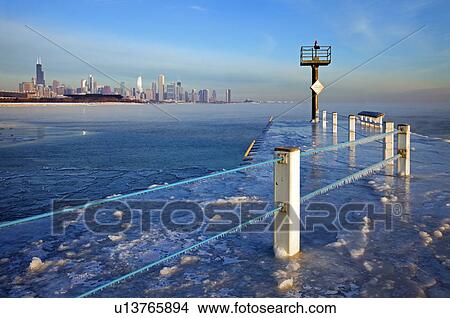 USA, Illinois, Chicago, frozen pier with cityscape on horizon View Large Photo Image Picture - USA, Illinois, Chicago, frozen pier with cityscape on horizon. Fotosearch
