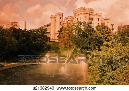 Stock Image - USA, Louisiana, Baton Rouge, Old State Capitol with fountain. Fotosearch