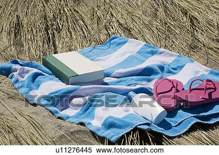 Stock Photography - USA, Massachusetts, towel on Marram Grass . Fotosearch